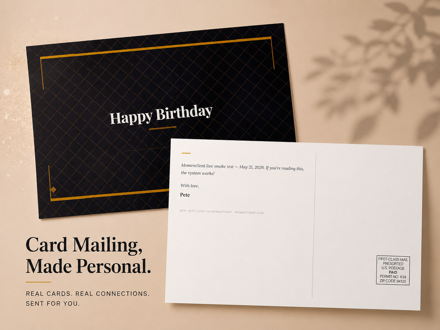 The real MomentSent greeting card mailed during the launch-day live test — a black 'Happy Birthday' card front and its printed message on the back.